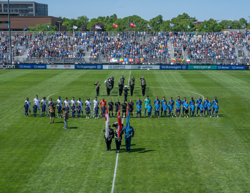 Halifax Wanderers FC and Vancouver FC line up before the DND Appreciation Match at Wanderers Grounds in Halifax, Nova Scotia.