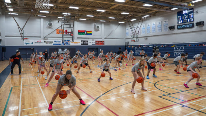 Young athletes participate in a ball handling drill during the Daneesha Provo Canadian Basketball Academy clinic sponsored by Nike Sports Camp Canada in Halifax, Nova Scotia.